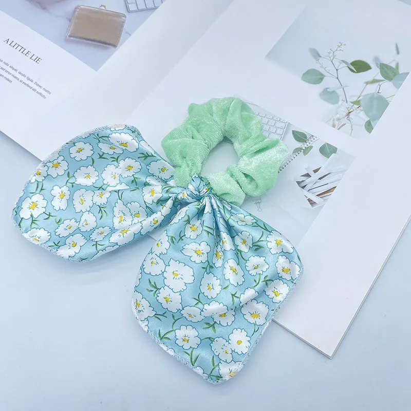 

Yanwenx Latest wholesale hair band new floral fresh and cute flannel headwear streamer hair ring ribbon hair scrunchies