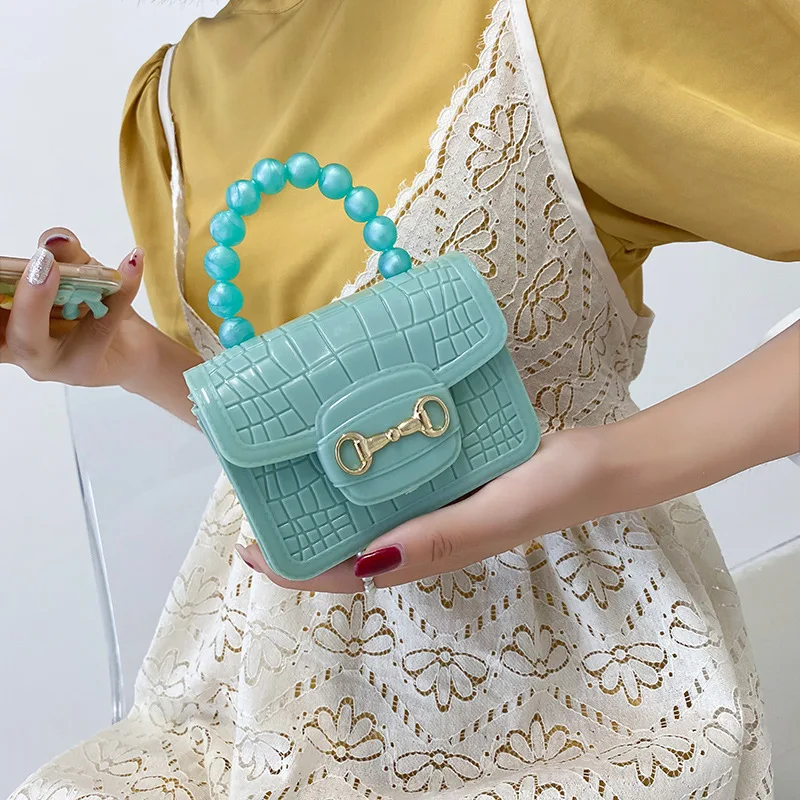 Children 2023 new Pearl color matching magnetic buckle portable mini crocodile pattern small jelly bag strapless red envelope