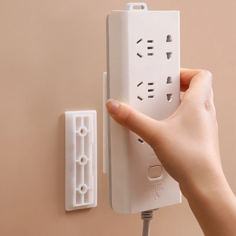 

Настенный самоклеящийся фиксатор для штепсельной вилки