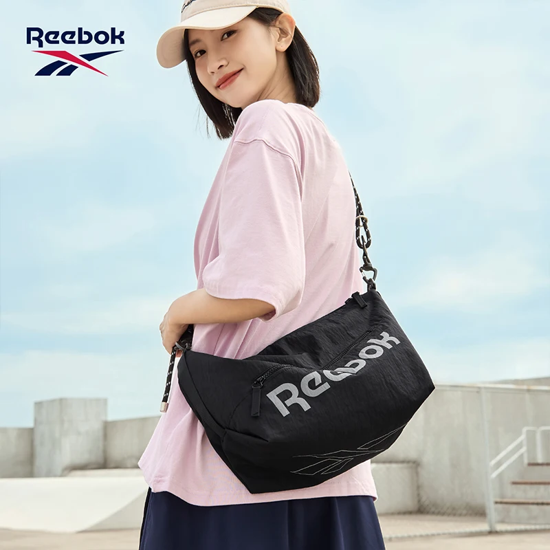Фото Сумка-мессенджер REEBOK унисекс, легкая, для активного отдыха, для мужчин и женщин, дизайнерская, повседневная, спортивная, наплечная сумка для поездок на работу. №1
