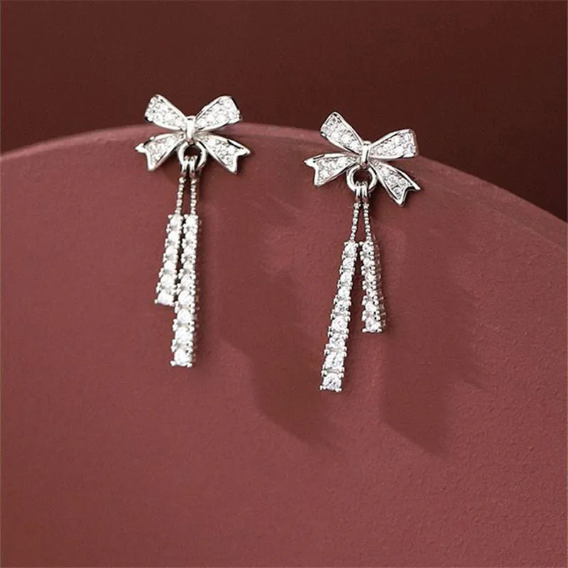 

Модные корейские милые серьги-гвоздики с кисточками и хрустальным бантом для женщин и девушек 2022 модные ювелирные изделия для вечерние рин...