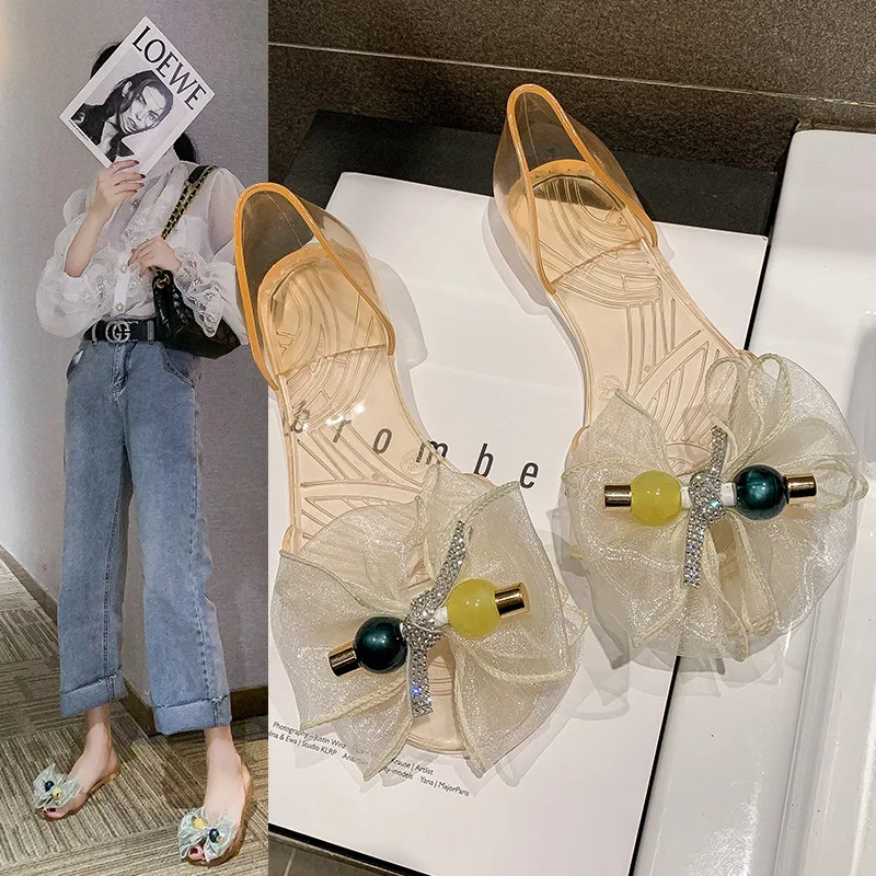 

Casual flat beach jelly shoes generation 2023 summer new fashion bow crystal transparent soft soled sandals