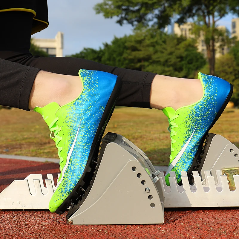 

Spike Shoes Track and Field Men Women Training Athletic Shoes Professional Running Track Race Soft Shoes Sneakers