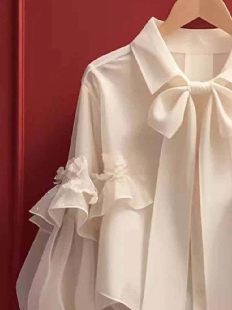 Женская блузка с бантом рукавами-фонариками и оборками