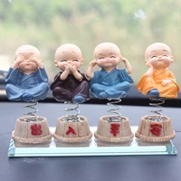 creative version q auto ornaments four little monk spring shaking head car accessories resin crafts wholesale