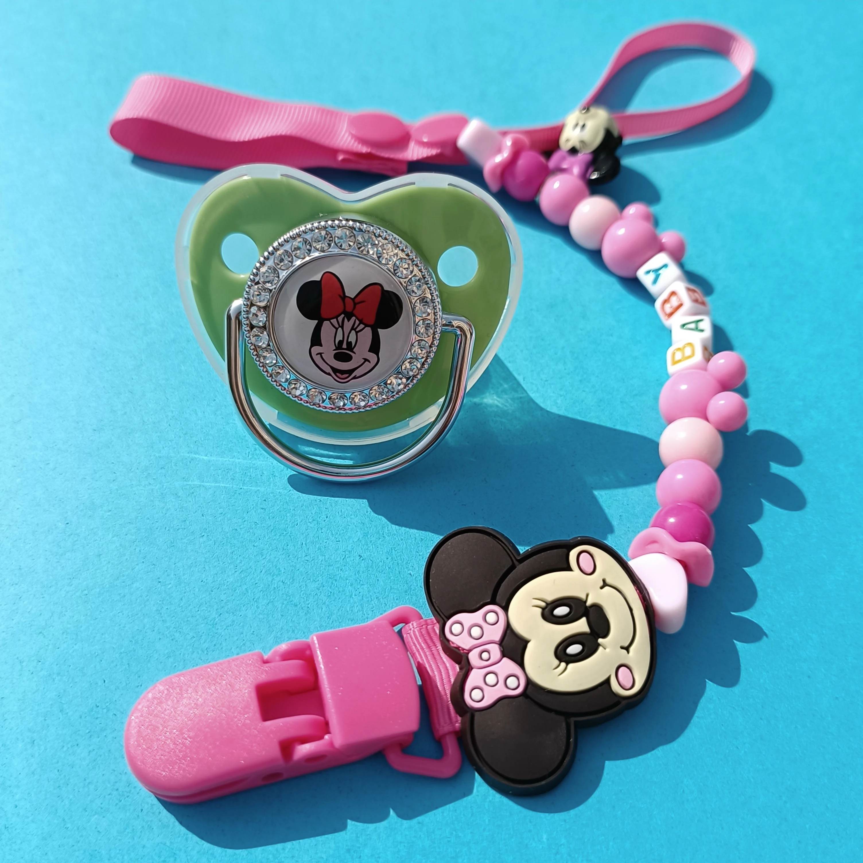 

Disney Baby Deluxe Pacifier with Pacifier Clip Silicone BPA Free Baby Pacifier for Newborn Baby Shower Bling Dummy Holder Gift