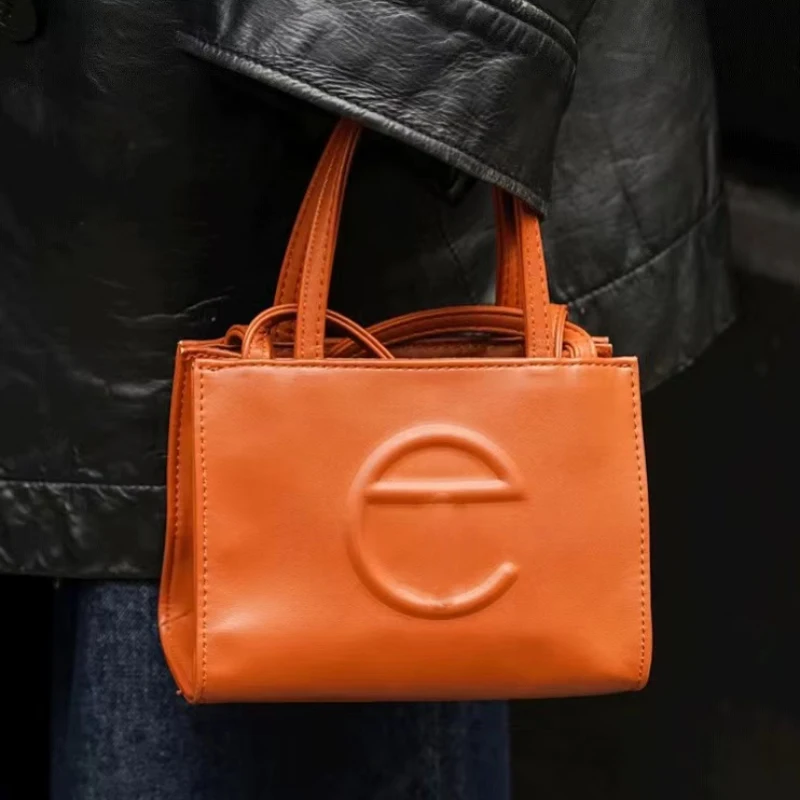 

Сумка на плечо нишевый дизайн 2022 простая TF Индивидуальная сумка трендовая сумка для покупок сумка-мессенджер с тиснением дизайнерская сумк...