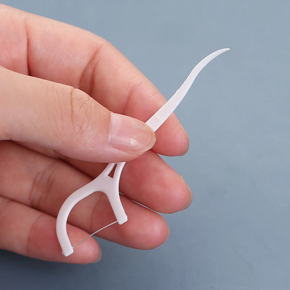 Портативные 50 шт. одноразовых зубных нитей для чистки зубов, зубочисток межзубной щетки, индивидуально упакованные.