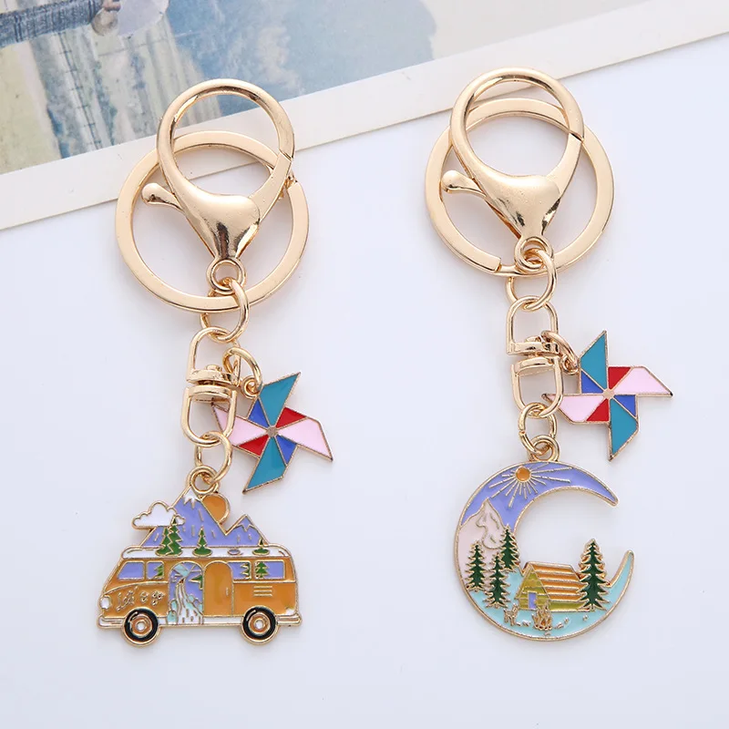 

New alloy holiday wind moon house keychain creative sun windmill snow mountain forest metal bag pendant