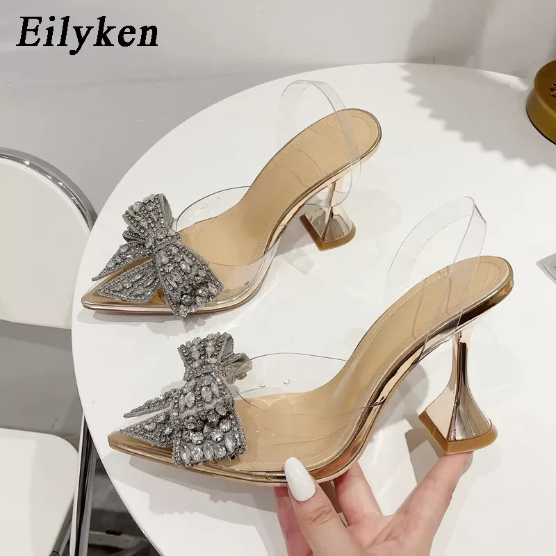 

2022New Eilyken Fashion Crystal Sequined Bowknot Women Pumps Sexy Pointed Toe High Heels PVC Transparent Sandals Wedding Prom Sh