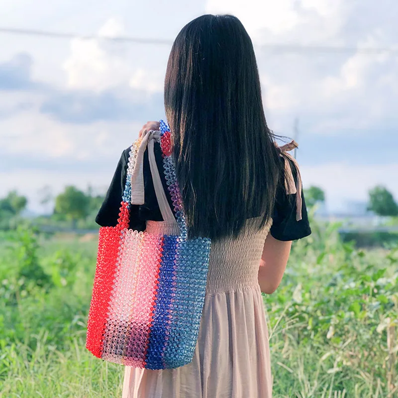 

New Trend Summer Vacation INS Wind Exquisite Lightweight Casual Rainbow Crystal Beaded Hand-woven Hand-held Shoulder Bag2022 Hot