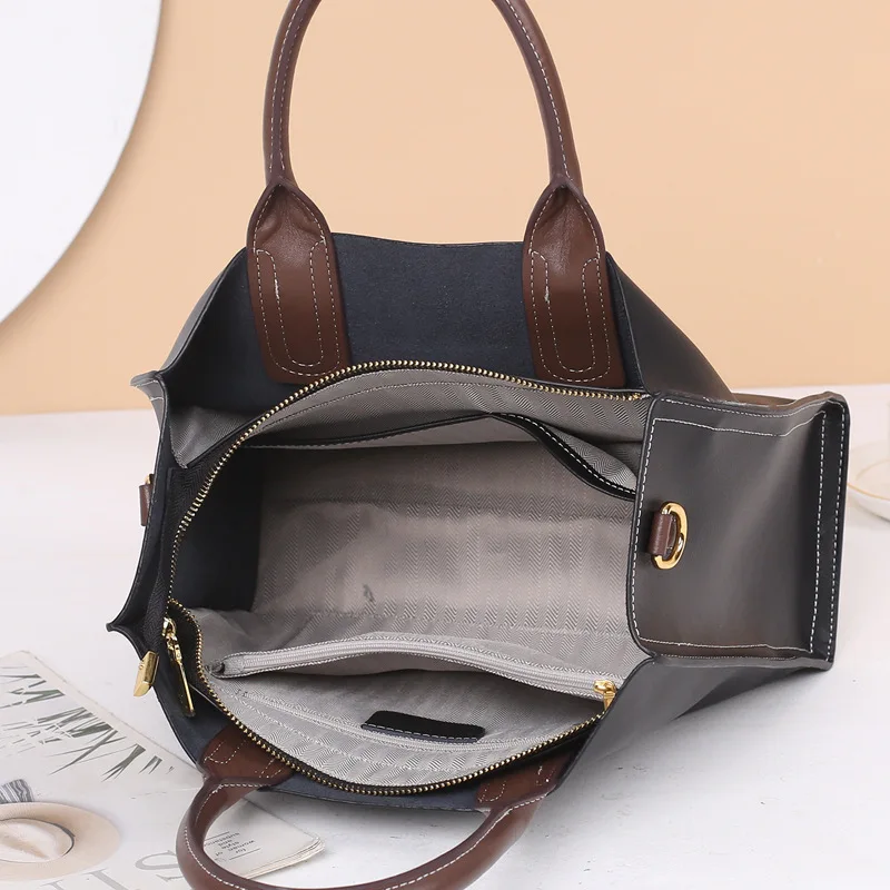 2023 new crossbody single shoulder large capacity handbag female leather commuter girls senior sense of cowhide tote bag