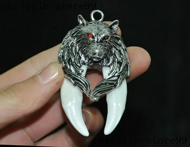 

China Tibetan silver Wolf head Wild boar tooth statue Exorcism amulet Pendant