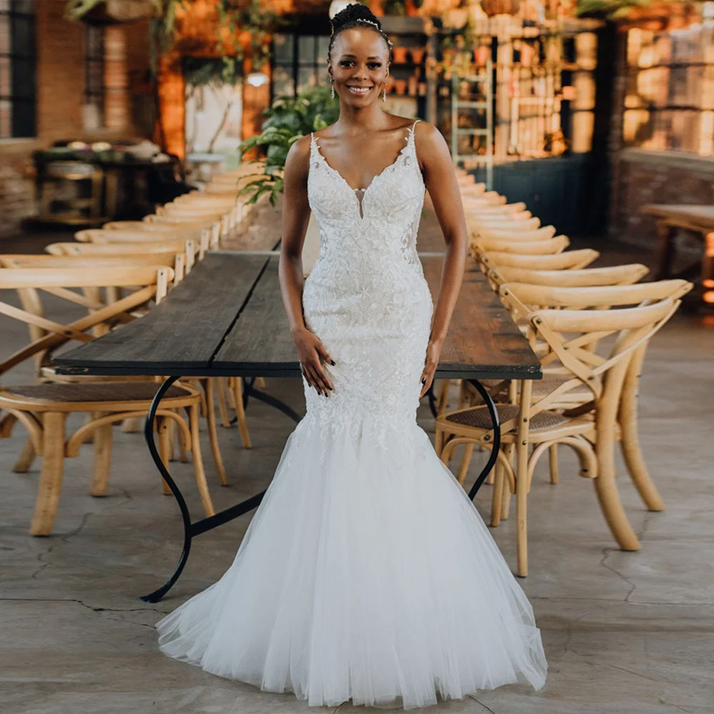 

Charming African Mermaid Wedding Dress V Neck Spaghetti Strap Floor Length White Bridal Gown Applique Backless Vestido De Novia