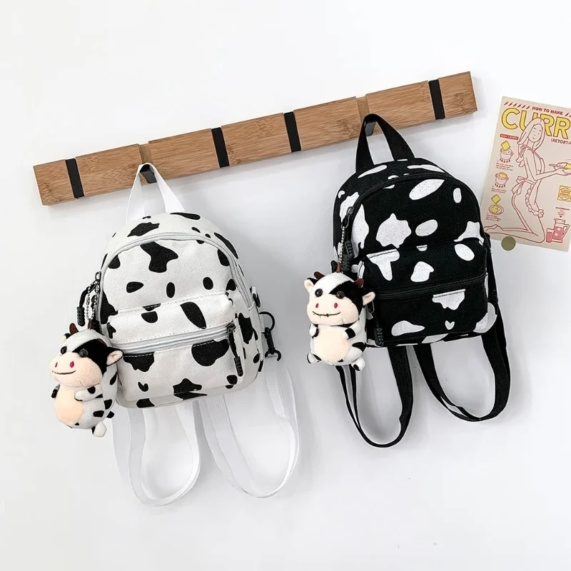 

Mini Canvas Daypack with Plush Pendant Cow Print Backpack for Women Lady Girls 20CA