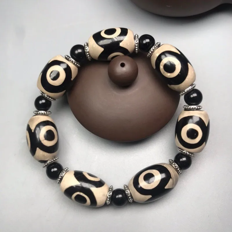 

Natural Tibetan dzi bead agate black lava stone bracelet men and women retro healing stone three-eyed dzi bead tiger eye bracele
