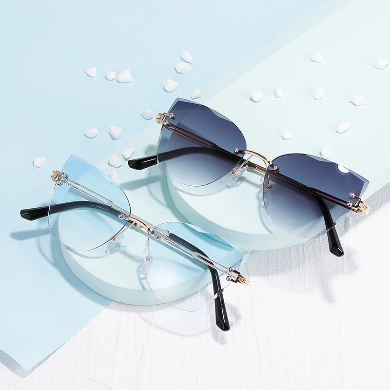 

2022 New Luxury Fashion Sexy Cat Eye Sunglasses Women Rimless Wave Sun Glasses Metal Shades for Vintage Women Eyewear UV400