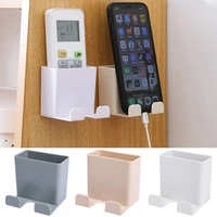 wall mounted storage box organizer air conditioner remote control storage case mobile phone hanging plug holder stand container