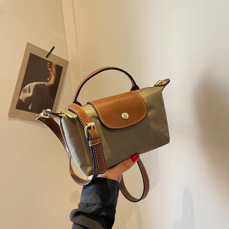 

This year's popular nylon for women in 2023 new niche design one shoulder crossbody texture portable dumpling bag Hot Recommend