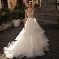 luxury wedding dress 2022 a line v neck sleeveless beaded modern bridal gowns sweep train buttons ruffle illusion wedding gown