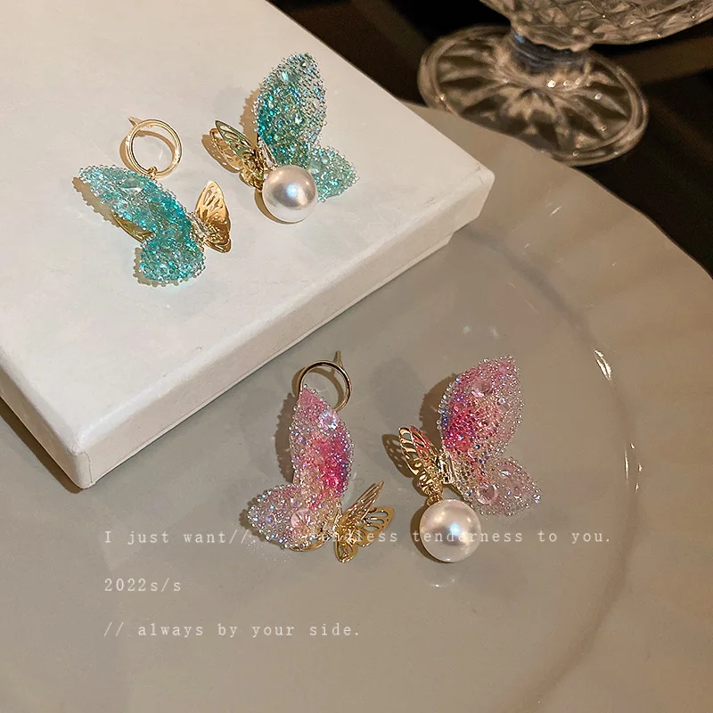 

Silver needle set with diamond pearl butterfly earrings Korean fashion sweet asymmetrical earrings net red temperament earrings