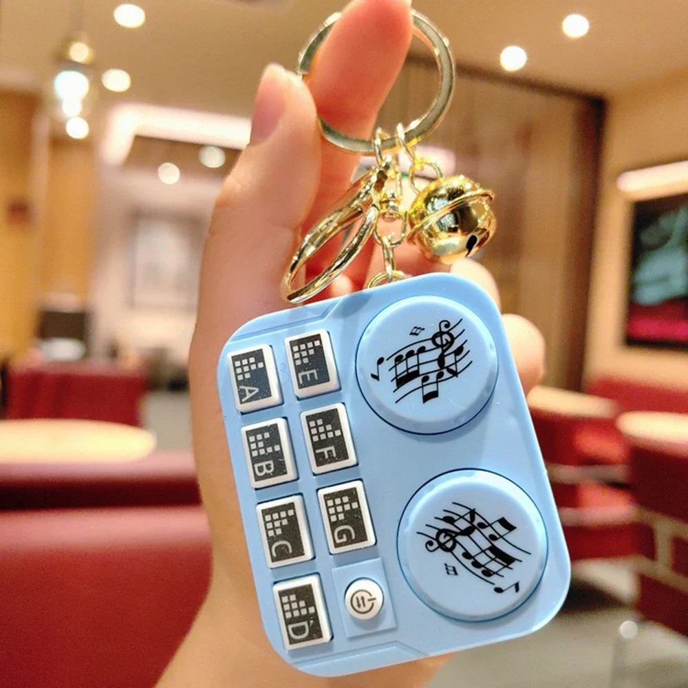 

Музыкальный брелок-дисковый проигрыватель