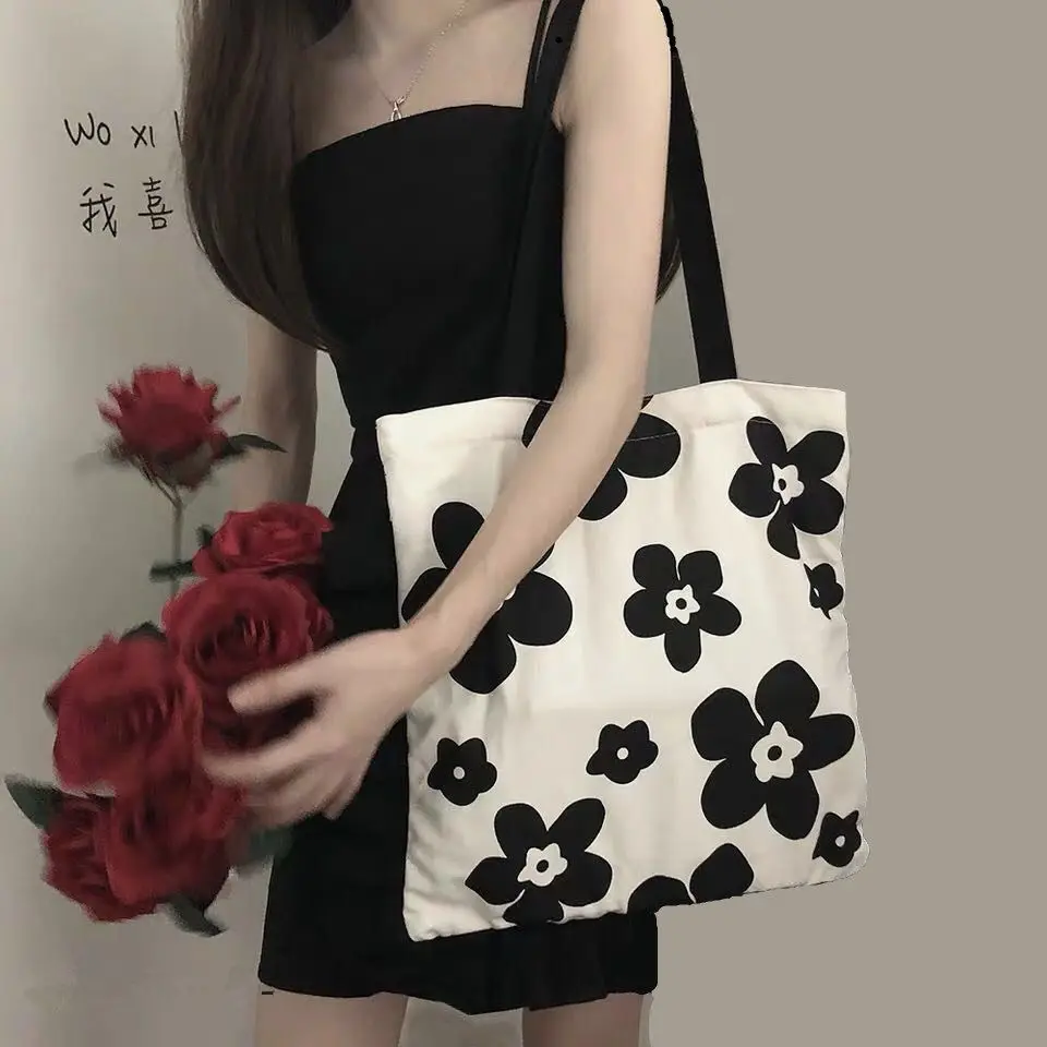 INS Canvas Bag Black and White Hyunya Flower Female Student Fashion Versatile Shoulder Bag Large Capacity Shopping Bag