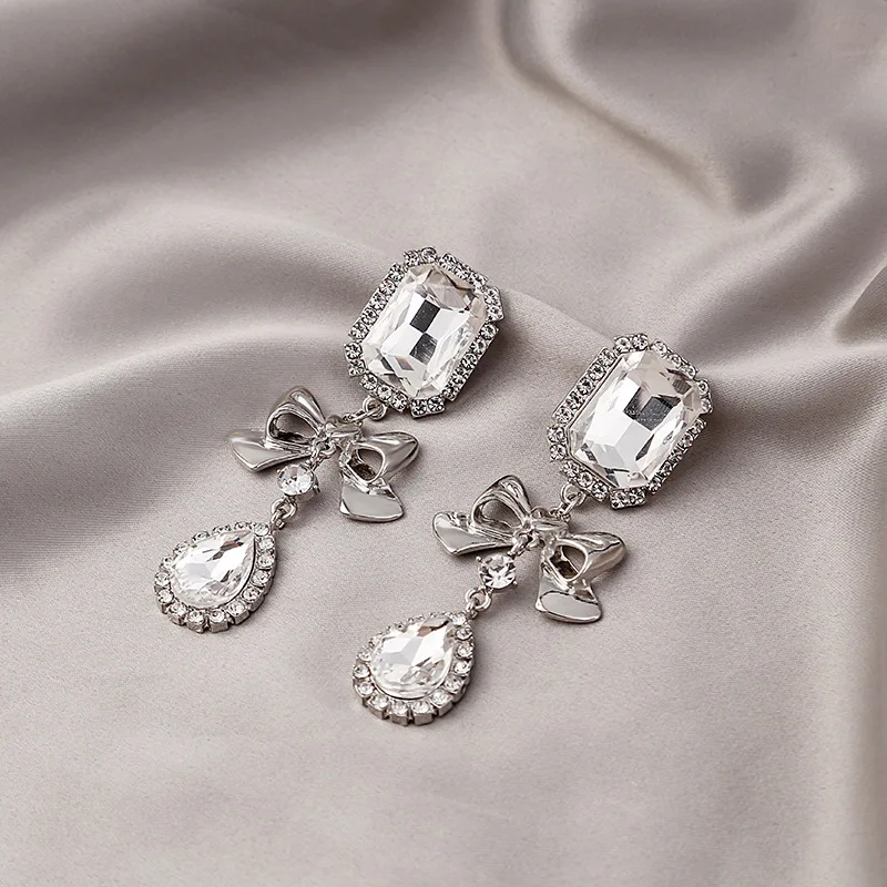 

Korean Fashion Magic Bow Stud Earrings Inlaid Shiny Zircon Water Drop Earrings Jewelry for Women Girl Party Jewelry Gifts