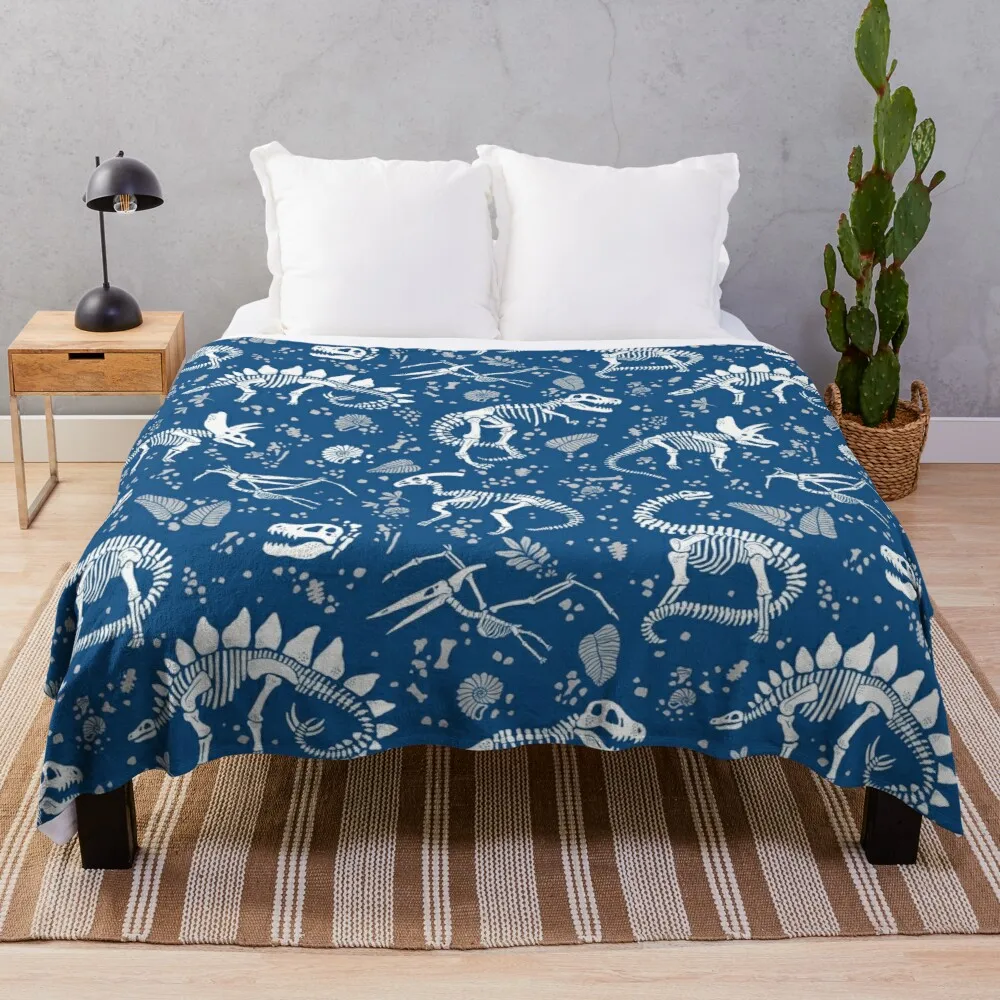 

Excavated Dinosaur Fossils in Blue Throw Blanket