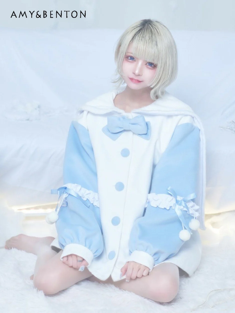 

Женское однобортное пальто с рукавами-фонариками и бантом