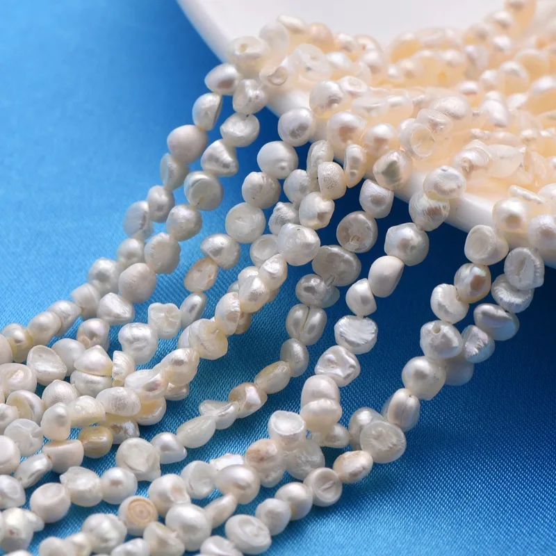 

1Strand Grade A Freshwater Pearl Beads Two sides Polished White bead: 3~4mm in diameter hole: 0.8mm 14.1 inch 97pcs/strand