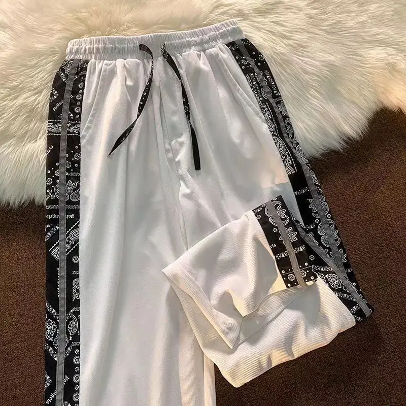 

American hiphop pants high street ins tide brand cashew flower striped sweatpants men and women oversize corduroy pants