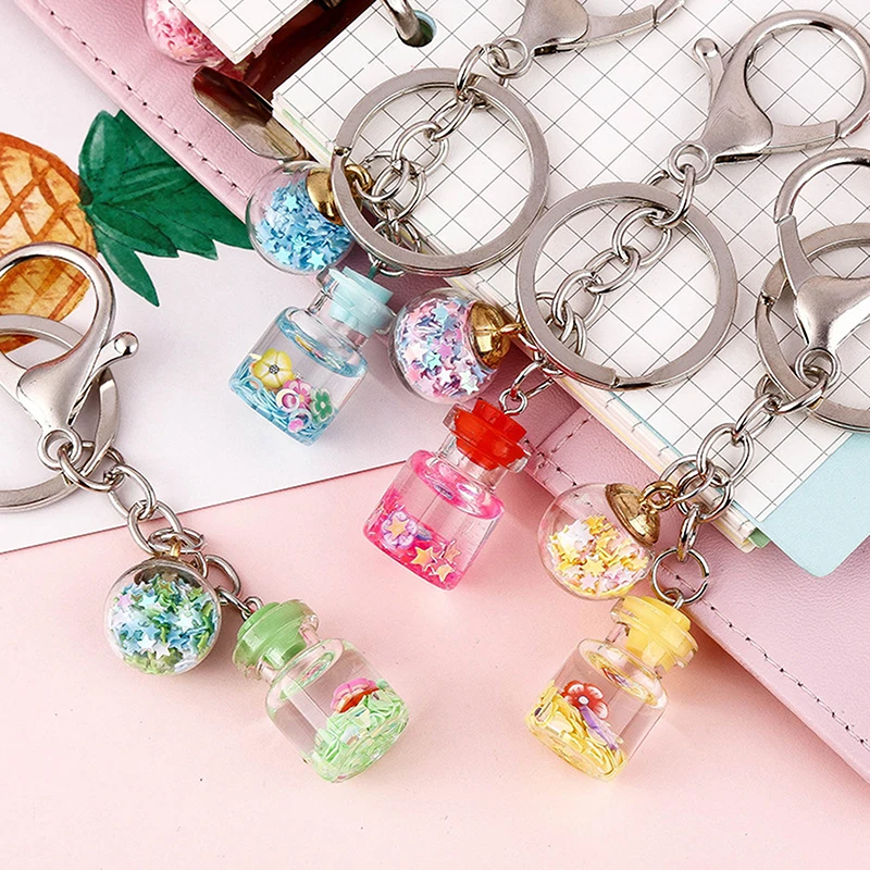 

New Trendy Cute Flower Quicksand Bottle Keychain Creative Keyring Charms Women Bag Ornaments Car Key Pendant Accessories Jewelry