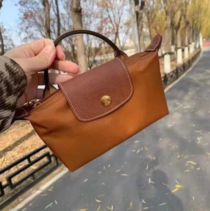 

2023 New Fashion Mobile Bag Mini Handheld Dumpling Bag Female Handheld Makeup Bag Add Shoulder Straps designer bag handbag