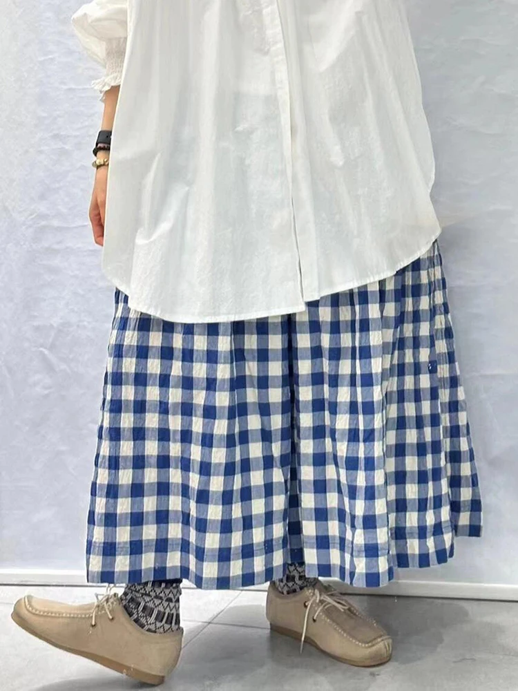 Женские клетчатые брюки в клетку с широкими штанинами