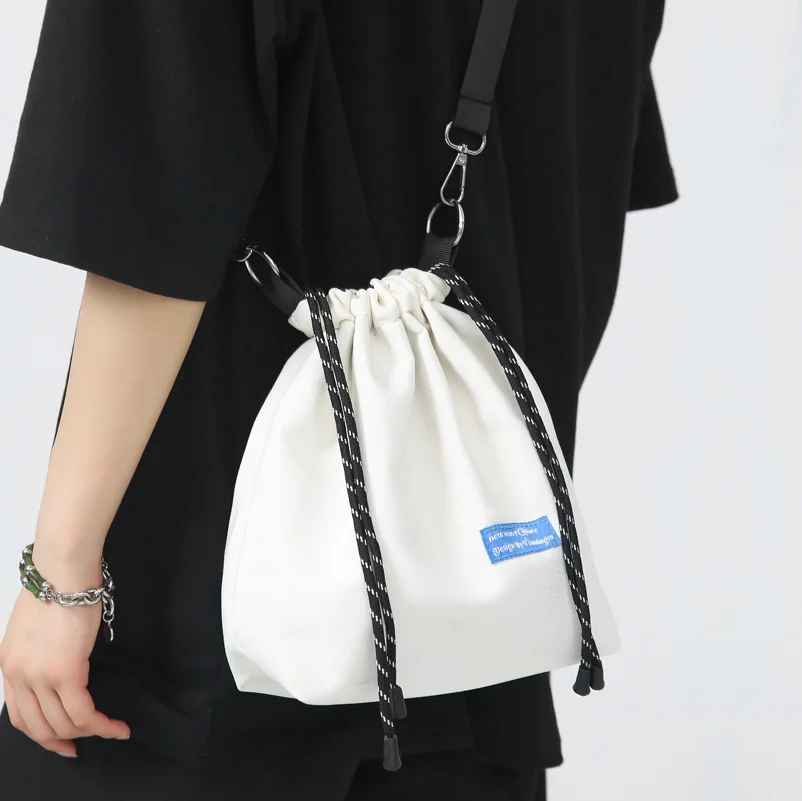 

Hot Portable Design Nylon Messenger Bag Fashion Brand Shoulder Bag Light Casual Phone Bag Couple Bag Small Drawstring Bucket Bag