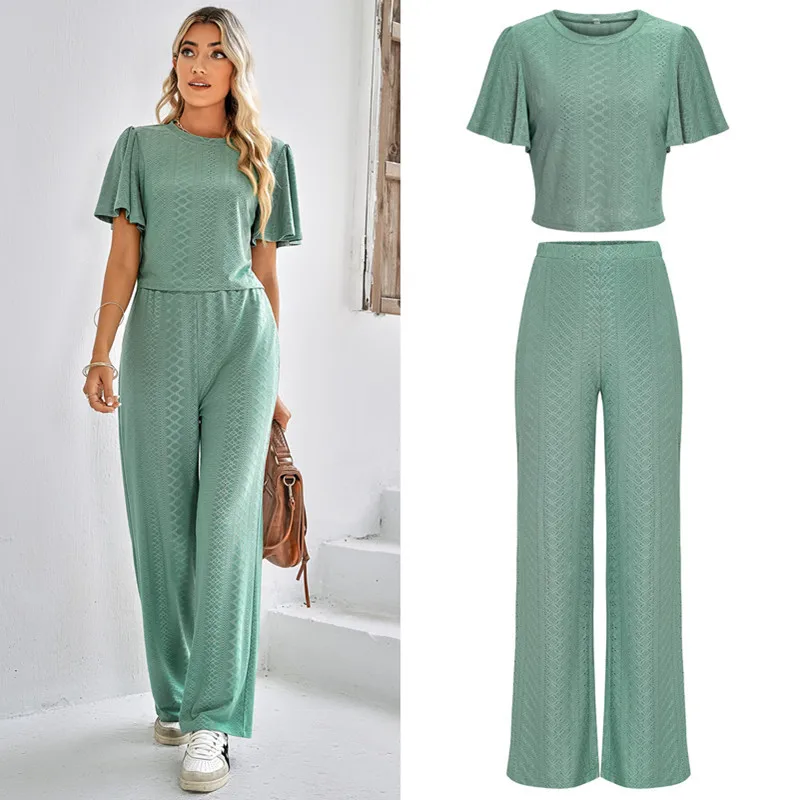 

2023 Spring and Summer New Women's Fashion Solid Color Casual Hollow Knitted Round Neck Trousers Suit Two Piece Sets