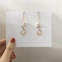 long tassel gold color pearl drop earrings for women korea fashion hollowed round bowknot metal chain earing sexy party jewelry