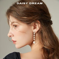 long pearl fringe earrings for womens niche design in 2022 new fashionable temperament round face slimming silver pin earrings