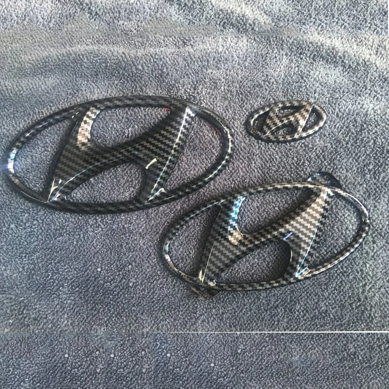 For Hyundai Feisi front emblem center mesh emblem rear emblem Feisi modified carbon black steering wheel emblem