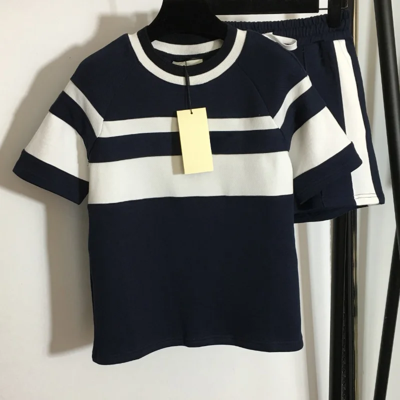 

2022 high quality women's suit fashion color matching loose short sleeve T-shirt women's top + temperament Elastic Waist Shorts