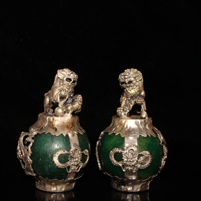 

Статуэтки дракона и льва из тибетского серебра