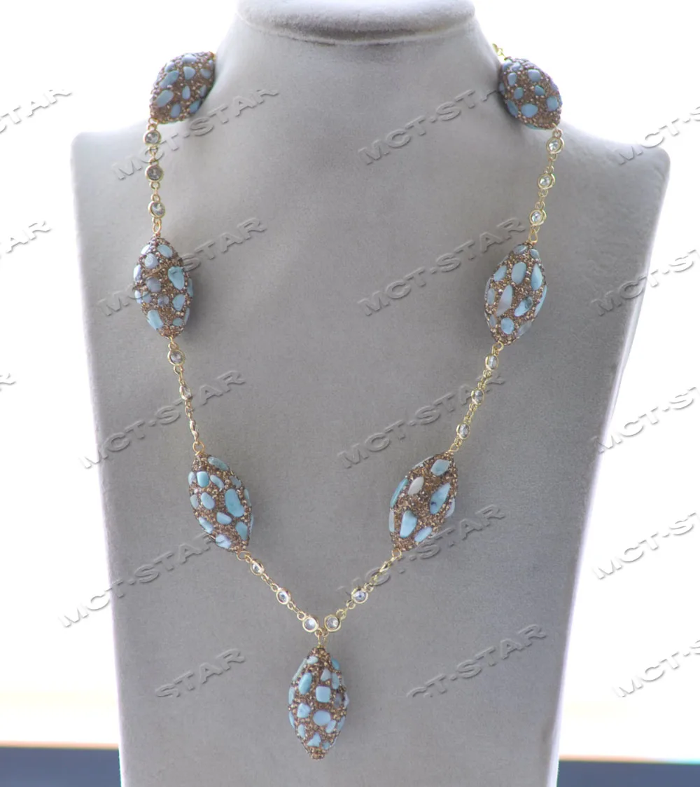 

MCT·STAR Z12343 22'' 30mm Blue Aquamarine Detritus All CZ Shuttle Chain Necklace Pendant