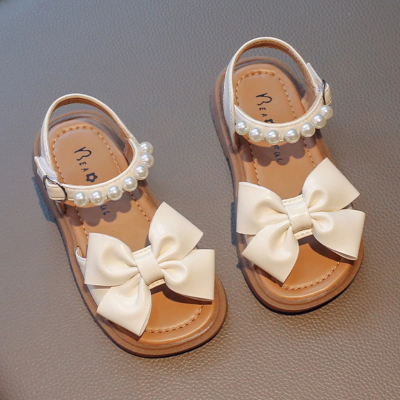 

Сандалии для девочек летние на мягкой подошве, с жемчугом и бисером, дышащие Нескользящие пляжные туфли с бантом, 2023