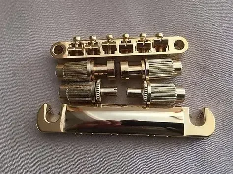 Фото 1 комплект Gold Tune-O-Matic SG для электрогитары и тайское золото №1