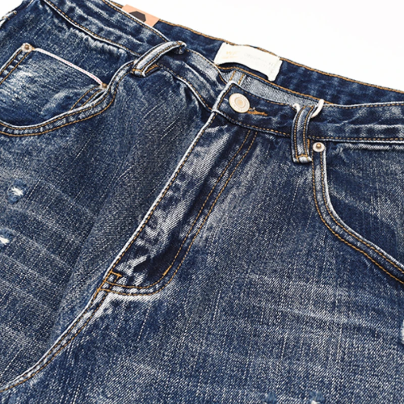 Red-eared Japanese-style retro jeans with old holes and heavy washing, loose straight micro-cone trousers.