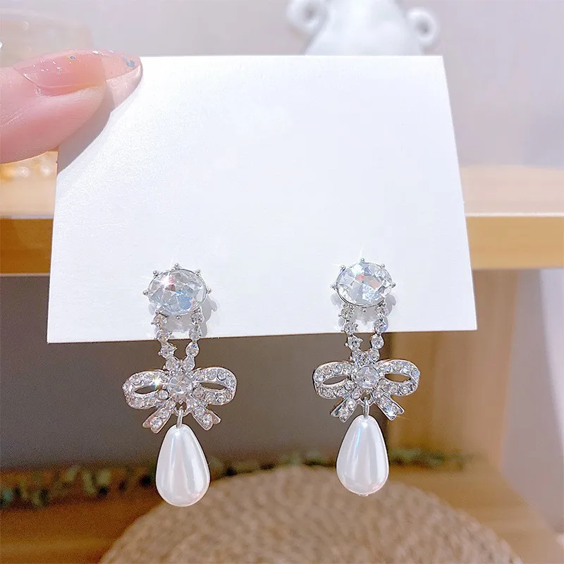 

2022 New Fashion Korean Fine Pearl Drop Earrings Long Contracted Sweet Bowknot Senior Women Earrings Jewelry