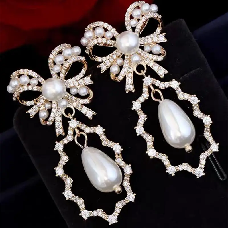 

SENYU New Bowknot Earrings Zirconia Paved Hollow Stripe Wrap Teardrop Pearl Women Jewelri Anniversary Banquet Bride Drop Earring