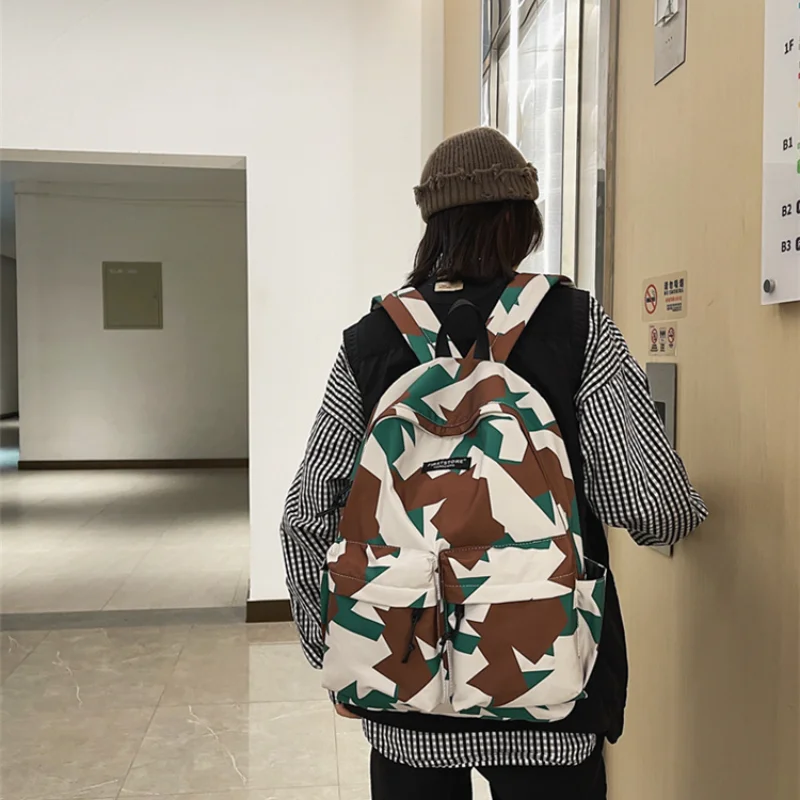 Korean fashion couple large capacity backpack female personalized graffiti double button bag student schoolbag male Backpack