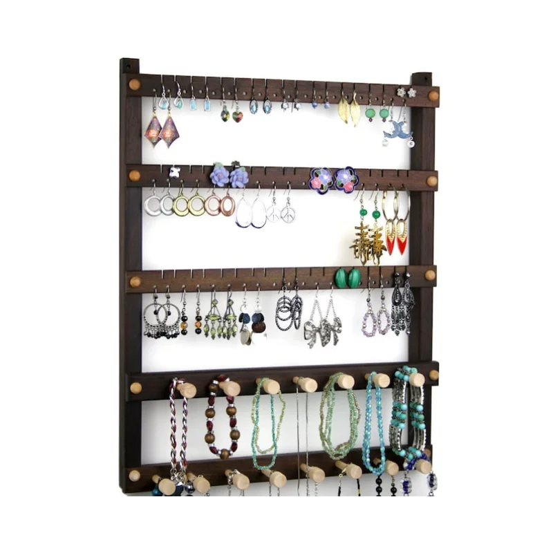 

Hanging, Wood, 2 Necklace Bars. 54 pairs of Earrings, plus 15 pegs. Jewelry Organizer